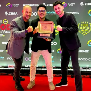 Spring Feeling Meal Kit management team holding the Food Services Award after being voted #1 for Innovation in Menu Design, Display & Presentation in the UAE.